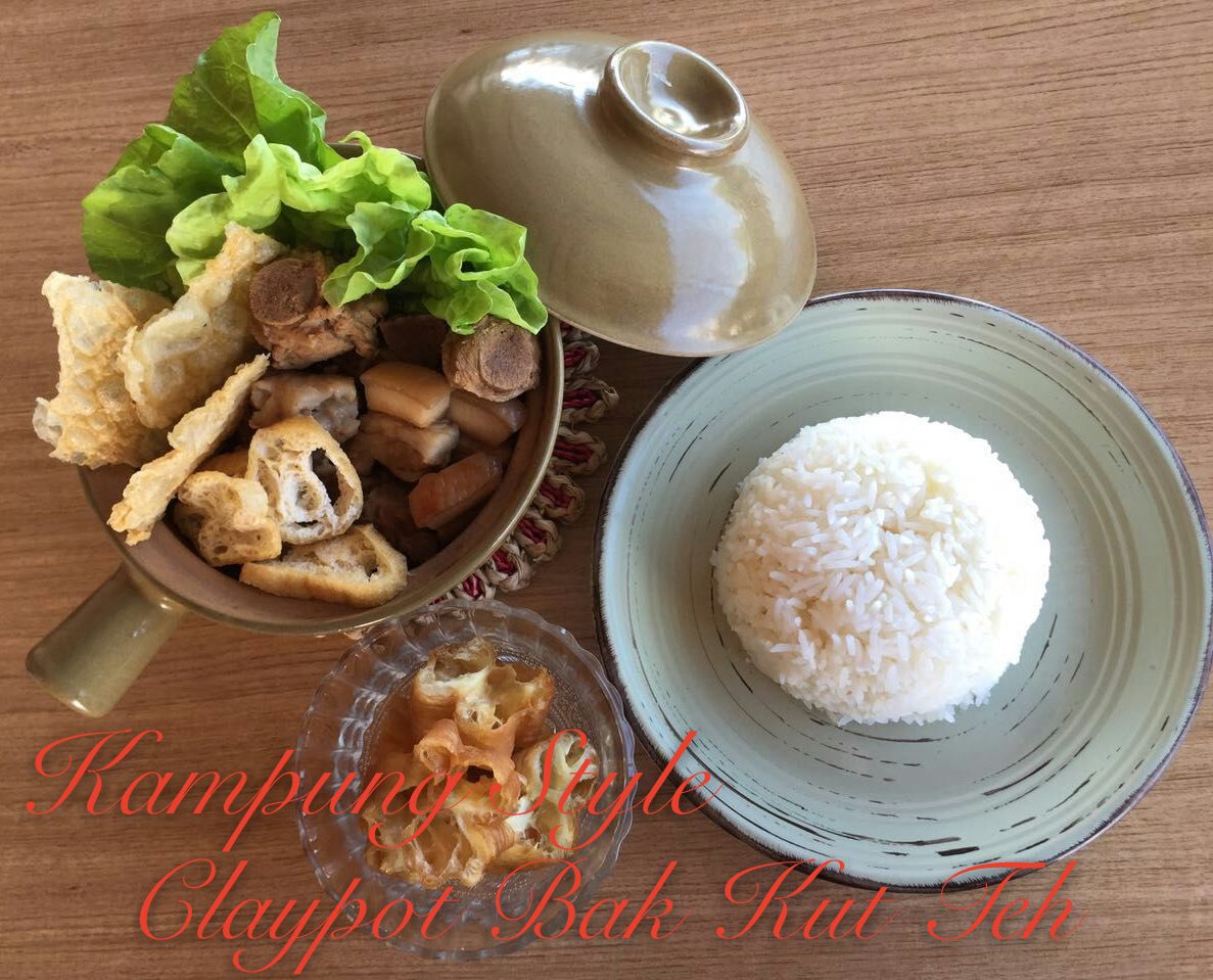 Claypot pork rib with rice and a side of greens